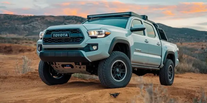 Toyota Tacoma long-travel kit with enhanced suspension components for off-road adventures.